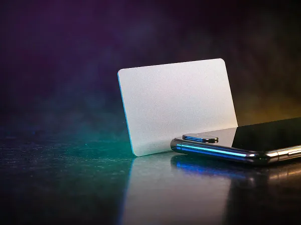 jjjpk Blank card beside a smartphone