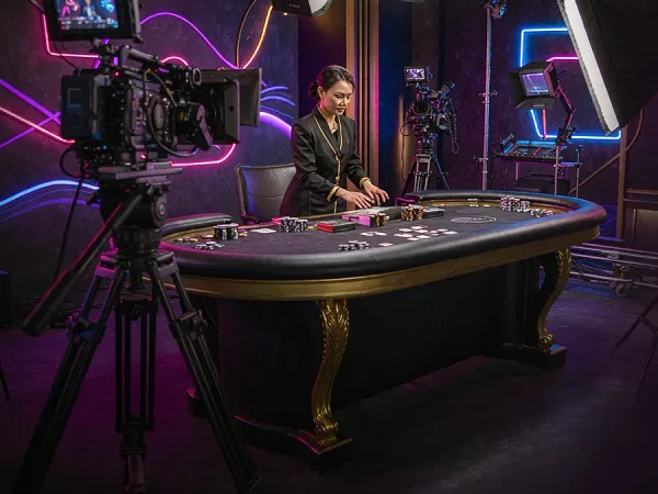 jjjpk Camera and studio lighting facing a casino table